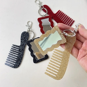 Glittery mini comb and mirror keychain set in black, red, and gold glitter finishes