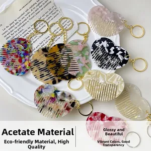 Macro shot of assorted heart-shaped acetate combs with gold keychains on a white tray