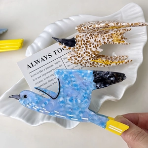 Chic swallow bird hair claw clips in leopard and blue marble acetate with yellow accents