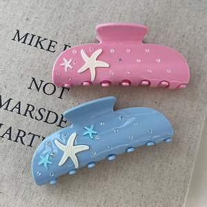 Summer sea star hair claw clips in pink and blue resin with rhinestone accents