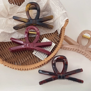 Elegant 4-piece set of large minimalist bow hair claws in tortoiseshell and solid colors