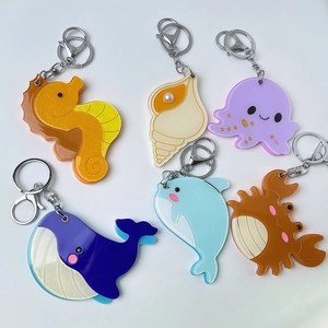 Acryl-Schlüsselanhänger Ocean-Serie mit Wal und Seestern als Taschenaccessoires