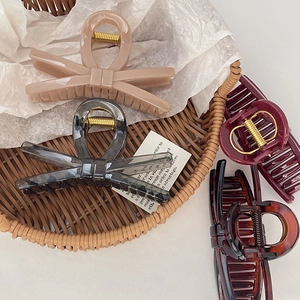Thick bow hair claws set in matte colors and tortoise shell style for elegant styling