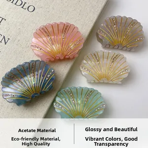 Detail of five-color acetate shell hair claws with sparkling rhinestones and pearl luster