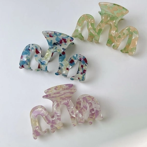 Minimalist floral marble acetate hair claw clips for women with wavy design in three colors