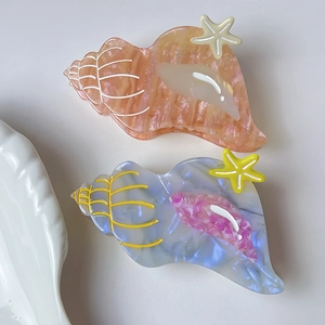 Elegant sea shell hair claws in peach and blue acetate with starfish detail