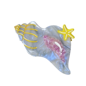 Marine conch hair claw in grey marble acetate with yellow starfish detail for women