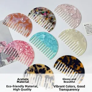 Detail view of colorful acetate hair combs in tortoise and marble patterns on white background