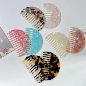 Semicircle acetate wide-tooth hair combs in various retro patterns for smooth styling