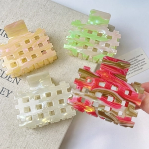 Chic acetate hollow shark hair claws in four colors including peach and marble texture