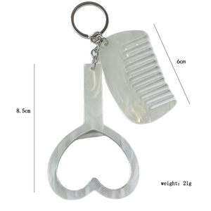 Détail du porte-clés miroir et peigne en forme de cœur avec dimensions et poids affichés