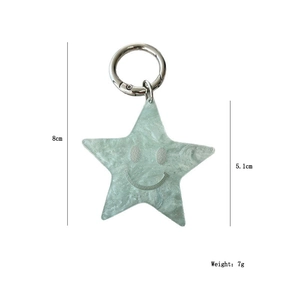 Detailed size map of green acrylic star keychain with silver clip and smile face design