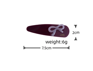 Detail view of purple acetate bow hair clip with France Handmade text and size dimensions