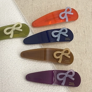 Handmade acetate teardrop hair clips with contrast bow detailing in multiple colors