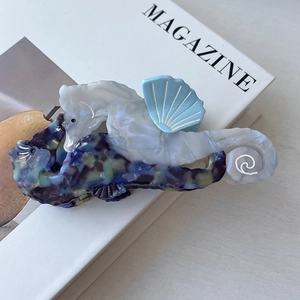 Macro shot of marble texture sea horse hair clip made of premium acetate material