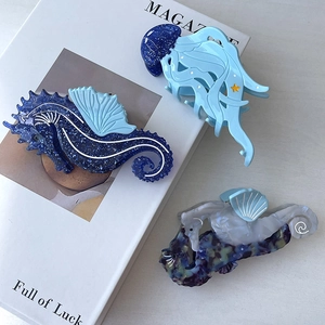 Ocean series hair claws featuring blue jellyfish and seahorse shapes in acetate material