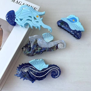 Ocean series acetate hair claws featuring blue jellyfish, conch and seahorse shapes