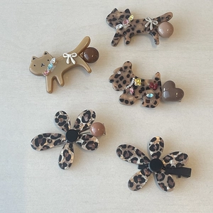 Five-piece leopard print acetate hair clips set featuring cat and flower shapes with rhinestones