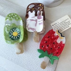 Cute ice cream shaped acetate hair claws featuring kiwi and strawberry patterns