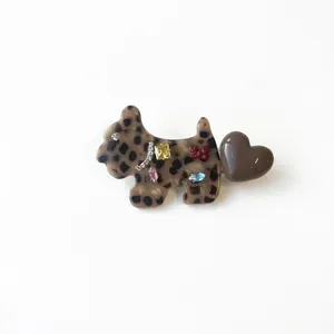 Leopard print acetate Scottish terrier hair clip with rhinestones and a red bow