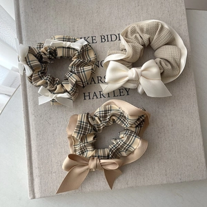 Three-piece set of beige cream polka dot scrunchies with elegant satin bows