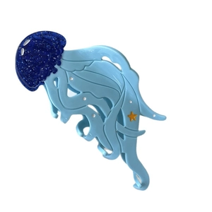 Ocean blue jellyfish hair claw clip with silver glitter and starfish detail on white background