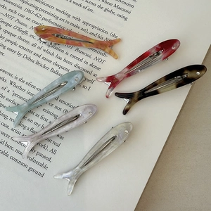 Y2K fish-shaped acetate hair clips set with glossy marble patterns and rhinestones