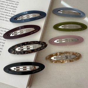 Hollow oval acetate hair clips in assorted tortoiseshell colors and solid matte finishes
