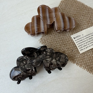 French heart-shaped hair claw clips set with brown stripes and marble acetate finish