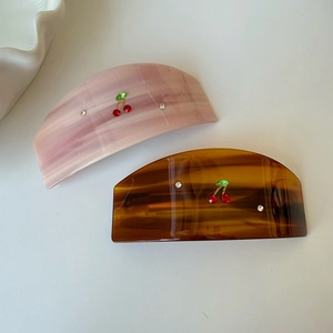 Elegant acetate cherry hair claw clips with rhinestones in pink and amber marble textures