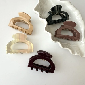 Set of five minimalist handmade acetate hair claws in assorted neutral tortoiseshell colors
