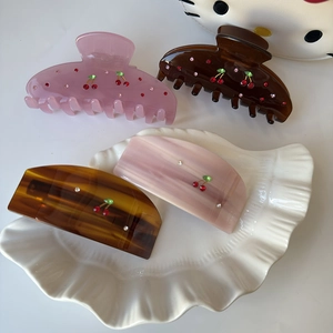 Elegant acetate cherry hair claw clips with rhinestones for women, various shapes in shell dish