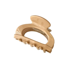 Minimalist milk tea color acetate hair claw clip with handmade engraving on white background