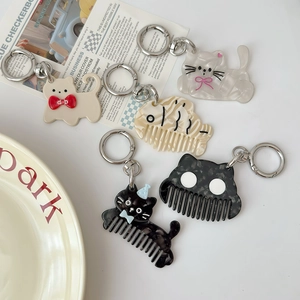 Chic acetate cat and fishbone comb keychains in assorted patterns with metal clasps