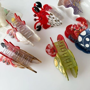Creative marine life hair claws featuring lobster and crab shapes in vibrant acetate colors