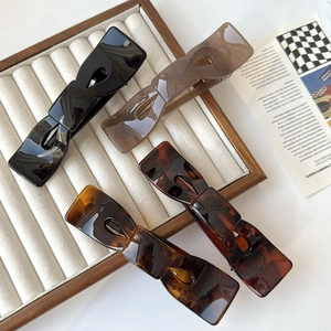 Set di quattro eleganti fermagli per capelli in resina, colori nero, grigio fumo e tartaruga