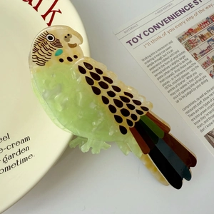 Pinza per capelli a forma di parrocchetto in acetato verde e giallo per donne