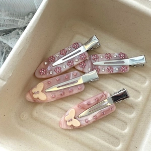 Pink acetate hair clips with rhinestones, marble texture and floral butterfly designs