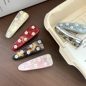 Korean style floral acetate hair clips with daisy patterns in multiple colors