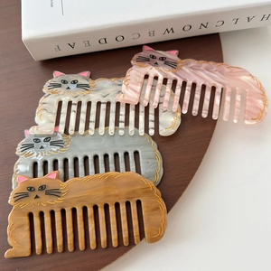 Cute set of 4 acetate cat hair combs with marble texture and gold detailing