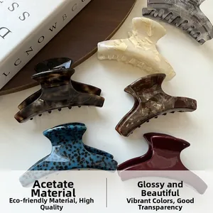 Close-up of assorted acetate hair claws featuring marble and tortoiseshell patterns