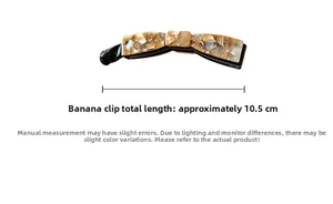 Détail de la pince banane de 10,5 cm avec une élégante texture de marbre ambré