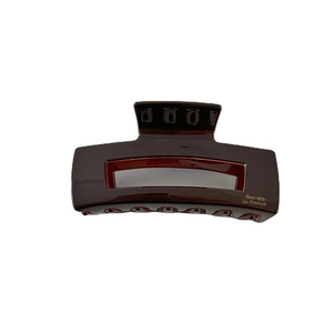 Glossy chocolate brown hollow rectangular hair claw clip with golden Barrette La France text