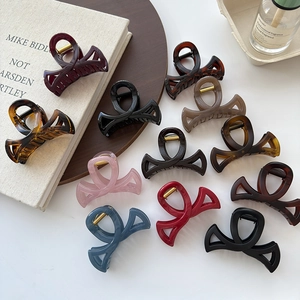 Pince à Cheveux Coréenne Nœud Creux Grande Pince en Résine pour Femmes Élégant Minimaliste Accessoire de Coiffure