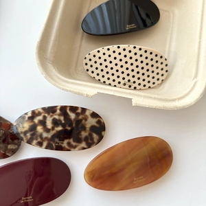 Elegant oval acetate hair barrettes in various tortoiseshell and solid colors for women