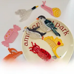 Detail of colorful acetate hair combs in cute animal shapes like bird and snail