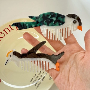 Creative bird-shaped acetate hair combs with marble texture in green and brown finishes