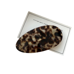 Classic tortoise shell acetate oval hair barrette with gold French lettering