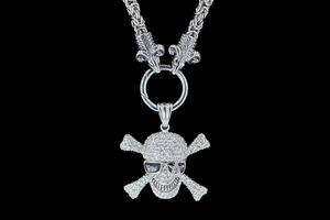 Detailed punk skull pendant with crystal pavé and ram head clasp on Byzantine chain