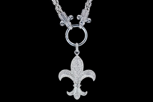 Macro view of gothic iris flower pendant with ram heads on heavy metal chain